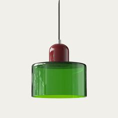 a green and red light hanging from a ceiling