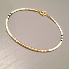 Dainty gold bracelet Elegant Slim Bracelet Dainty bracelet Minimalist White Bracelet With Gold Beads, Handmade Minimalist Gold Friendship Bracelets, Minimalist Handmade Gold Friendship Bracelets, Elegant Gold Friendship Bracelets With Gold Beads, Gold Beaded Minimalist Friendship Bracelets, Gold Bangle With Tiny Beads, Elegant Gold Bangle Friendship Bracelets, Adjustable Simple Gold Bracelet, Simple Gold Beaded Bracelets As Gift