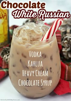 chocolate russian drink in a glass with whipped cream and candy canes on the side