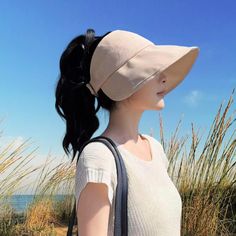 FREE Standard U.S Shipping on all orders over $35 Women's Sun Hat Ponytail - Wide Brim Bucket Hat with Ponytail Hole - Trendy Open Top Summer Hat - Perfect for Stylish Beach Looks 💕 These summer hats women are made of 100% cotton fabric, lightweight, breathable and comfortable to wear. Foldable Pony Tail Hat: packable and will fit your handbag when not in use, so you can bring this ponytail beach hat everywhere with you. Ponytail sun hat comes with removable wind proof rope / chin strap for windy days. This large sun hat will make nice shade for your face and neck! Ponytail bucket hat makes a unique gift for women. ONE SIZE: Head circumference 21.5 - 23 inch (56-59cm). Adjustable fit S M L Open Top Hat design - Friendly to curly hair, high ponytail hat, messy bun hat, high pony caps. Ship Beige Bucket Hat With Visor, Adjustable Brimmed Baseball Cap With Uv Protection, Adjustable Wide Brim Baseball Cap For Outdoor, Adjustable Solid Color Brimmed Baseball Cap, Casual Brimmed Visor In Solid Color, Casual Solid Brimmed Visor, Casual Solid Color Brimmed Visor, Trendy Solid Color Visor Hat, Adjustable Brimmed Baseball Cap For Spring