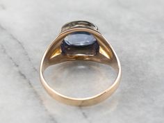 This sapphire ring makes a real statement on the hand! The sapphire is set in an east to west orientation and rises in a dramatic high profile design. The gold has a bright polish that shines beautifully next to the cornflower blue stone! Metal: 10K Yellow Gold Gem: Sapphire 4.46 Carats Gem Measurements: 8.3 x 10.3 mm, Oval Ring Size: 10.25 Marks: "10KA" Stamped on the inside band Timeless Blue Gemstone Signet Ring, Heirloom Style Polished Sapphire Ring, Blue Classic Amethyst Ring For Formal Occasions, Mens Sapphire Ring, Sapphire Ring Vintage, Yellow Gold Sapphire Ring, Vintage Sapphire Ring, Band Metal, Vintage Sapphire