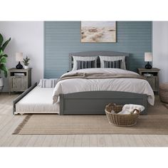 a bedroom with a bed, nightstands and a basket on the floor in front of it