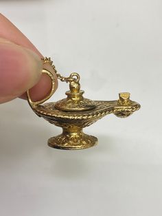 9ct Vintage Solid Yellow Gold Opening Magic Lamp Pendant 🔹Length - 30.5mm 🔹Weight - 8.9 grams  🔹Price - £465.00 All articles come presented in a gift box Gold Jewelry With Gift Box For Keepsake, Gold Jewelry Keepsake With Gift Box, Gold Jewelry With Gift Box, Antique Gold 14k Stamped Jewelry As Gift, Antique Gold Jewelry Stamped 14k As Gift, Gift Antique Gold Jewelry Stamped 14k, Classic Bronze Jewelry Gift, Classic Bronze Jewelry For Gifts, Classic Gold Jewelry With Gift Box