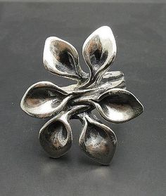 Sterling silver ring 925/1000, flower. Stamped 925.Approximate weight 11.6 grams. Top width 3.3 cm (1.24 inches). All our jewels are made from solid sterling silver 925/1000 and are carefully crafted by hand in our family workshop. We dispatch your orders in 5 working days, worldwide and the postage is $5. We ship registered priority mail. Please allow 5-7 working days for delivery in Europe and 10-15 working days outside Europe. For any questions - please do not hesitate to contact me! Nature Rings, Handmade Sterling Silver Rings, Nature Ring, Flower Photos, Handmade Sterling Silver, Sterling Silver Ring, Bulgaria, Floral Rings, Silver Ring