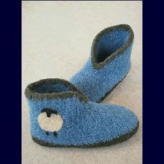 a pair of blue slippers sitting on top of a white floor