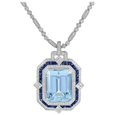 Platinum Set Pendant by Sophia D with 24.38 carats Aquamarine Center accented by Sapphires weighing 3.77 carats and Diamonds with a 3.68 carat total weight. Sophia D by Joseph Dardashti LTD has been known worldwide for 35 years and are inspired by classic Art Deco design that merges with modern manufacturing techniques. Vampire Jewelry, Platinum Pendant, Jewelry Rendering, Expensive Jewelry Luxury, Gemstone Art, Historical Jewellery, Aquamarine Pendant, Art Deco Pendant, Diamond Jewelry Designs