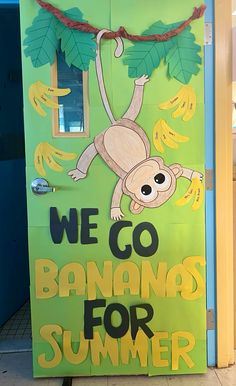 a door with a sign that says we go bananas for summer and a monkey hanging from the front