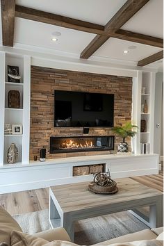 a living room filled with furniture and a flat screen tv mounted on the wall above a fire place