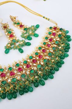 A beautifully handcrafted neckpiece worked in gold, finished with an array of semi-precious gemstone drops and encrusted with kundan. This choker set is based in silver alloy plated with 22k gold. Necklace Closure - Adjustable Dori Earrings Closure - Push Back Necklace - 14 inches Earrings - 3.5 inches Style Tip - A perfect choker for someone who's styling decisions always start and end with putting timeless classics together to create a magical and unique look. An accessory so versatile, we are Festive Stone Necklaces, Festive Necklaces With Stones, Ceremonial Kundan Jeweled Necklace, Festive Multicolor Stone Necklaces, Jeweled Necklace For Celebrations And Festivals, Kundan Necklaces With Stones For Gift, Kundan Necklaces With Stones As Gifts, Festive Kundan Necklaces With Stones, Festive Gold Necklace With Stones