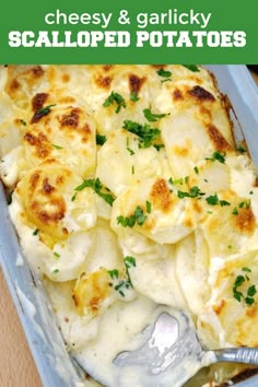 a casserole dish with cheese and garnished potatoes