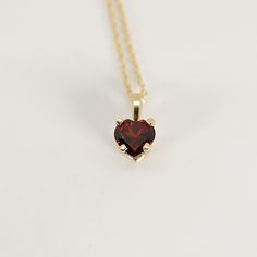 This 14k solid gold dainty minimal garnet heart necklace, Perfect Gift for Anniversary, Birthday or any Special Occasion to show someone you love them! DETAILS *** 14k solid yellow gold. *** Pendant dimension is 6mm x 6mm *** Necklace length is 16" to 18" adjustable *** Genuine garnet is 6x6mm heart shape. Thanks for visiting Melt'm Design Studio Garnet Heart Necklace, Garnet Necklace Gold, Ruby Heart Necklace, Garnet Heart, Gift For Anniversary, Garnet And Gold, Heart Shaped Jewelry, Heart Shaped Necklace, Garnet Necklace