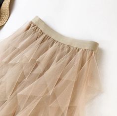 French Vanilla Tulle Skirt Ruffles tulle skirt. Maxi length. Elastic waistband. Partially lined. One Size. Summer Stretch Beige Skirt, Spring Stretch Mini Skirt Petticoat, Beige Pleated Skirt For Summer Party, Spring Stretch Lined Petticoat, Stretch Tulle Long Skirt, Long Mesh Skirt For Spring, Elegant Pleated Skirt Petticoat For Summer, Elegant Summer Petticoat With Pleated Skirt, Elegant Pleated Petticoat For Summer