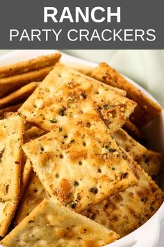 a bowl full of crackers with the words ranch party crackers in front of it