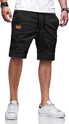 Stay comfortable and stylish with our Casual Summer Drawstring Closure Beach Shorts. Crafted from a high-quality blend of cotton and elastane, these shorts are lightweight, breathable, and perfect for warm weather. They feature a convenient drawstring closure and are easy to care for with a hand wash. With 2 side pockets and 2 reinforced back pockets, you can confidently carry your essentials wherever you go. Features: 98% Cotton, 2% Elastane Drawstring closure Hand Wash Only Quality Fabric: 98% Casual Shorts For Beach Season, Casual Shorts For Beach Season Leisure, Casual Beach Season Leisure Shorts, Casual Black Beach Bottoms, Casual Drawstring Shorts For Vacation, Beach Cotton Shorts With Drawstring, Cotton Beach Shorts With Drawstring, Beachwear Cotton Shorts For Leisure, Casual Bermuda Leisure Bottoms