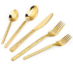 gold colored utensils and spoons on a white background