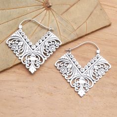 By Nyoman Ariawan these unique earrings come to life in sterling silver. Ornate tendrils and lavish petals culminate in a V shape for a very original fashion look. Elegant Filigree Hoop Earrings For Festivals, Elegant Festival Hoop Earrings With Intricate Design, Festival Sterling Silver Chandelier Earrings, Ornate Sterling Silver Jewelry For Festival, Elegant Sterling Silver Chandelier Earrings For Festival, Elegant Oxidized Hoop Earrings For Festival, Elegant Sterling Silver Hoop Earrings For Festival, Bohemian Sterling Silver Chandelier Earrings With Intricate Design, Silver Chandelier Earrings With Intricate Design For Festivals