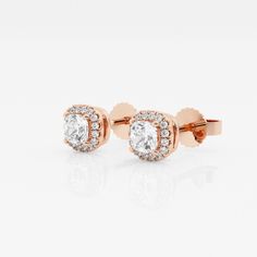 Soft cushion shaped lab grown diamonds are encompassed with smaller scintillating round diamonds in this halo styled stud earring pair. Whether you plan to wear it to work or to a brunch party with friends, these are sure to be attention-grabbers. Rose Gold Diamond Earrings With Halo Setting For Gift, Rose Gold Halo Setting Diamond Earrings, Rose Gold Diamond Halo Earrings, Luxury Rose Gold Diamond Earrings With Halo Design, Rose Gold Halo Setting Cubic Zirconia Earrings, Rose Gold Diamond Earrings With Halo, Rose Gold Cubic Zirconia Earrings With Halo Setting, Formal Rose Gold Halo Diamond Earrings, Fine Jewelry Rose Gold Halo Diamond Earrings