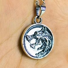 Immerse yourself in the world of fantasy role-playing games with this beautifully handcrafted 925 Sterling Silver Necklace, featuring the iconic Wolf School emblem, a powerful symbol known to fans of the genre. This stunning necklace draws inspiration from one of the most beloved fantasy gaming universes, making it an essential accessory for dedicated gamers and fantasy enthusiasts alike. Expertly crafted from premium 925 sterling silver, this necklace offers not only striking visual appeal but also exceptional durability. The high-quality silver ensures that the piece will maintain its lustrous appearance over time, making it a lasting addition to your jewelry collection. The Wolf School emblem, carefully designed with intricate details, represents strength, loyalty, and courage--qualitie Wolf Jewelry Necklaces, School Emblem, Necklace Drawing, Fantasy Wolf, Wolf Necklace, Wolf Jewelry, World Of Fantasy, The Wolf, Stunning Necklace