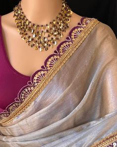 Silver mettalic tissue saree with contrast magenta golden lace all over sarees. Comes with beautiful big magenta thread tassels on pallu. Blouse: running blouse 80cm. To find this product in website: Www.thejacouture > Tissue sarees> silver mettalic tissue saree. Jewellery collaboration: @anvi__jewellery #mettalictissuesaree #silversaree #fancysaree #tissuesaree #trendingsaree #tissuelacesaree Saree Contrast Blouse