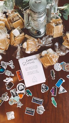 a wooden table topped with lots of stickers