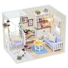 a doll house with furniture and accessories in it