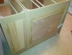 an unfinished kitchen cabinet in the process of being built