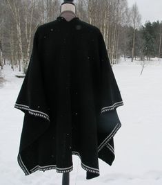 Men's knitted poncho oversized knit poncho blanket for men Knit Wrap Cape gift for mens Shawl for travel scarf-palantine unisex Elf - Shawl Stylish knitted poncho A casual drape and oversized shape lend versatile styling options to a softly knit wrap cape. Wrap it around the shoulder or just toss it over what you're wearing when you want an extra shield of comfort from cool air. Made from wool 100% you can order any size and color. Email me the width and length and I knit for you. With pleasure Black Wool Poncho For Winter, Black Wool Cape Poncho, Cozy Black Cape Poncho, Black Wool Shawl For Winter, Black Wool Winter Shawl, Black Knitted Shawl For Winter, Traditional Winter Poncho For Outdoor, Black Winter Cape For Outdoor, Black Winter Outdoor Cape