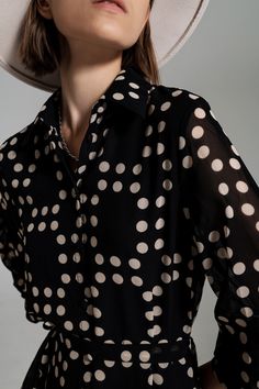 Introducing our elegant Fit and Frill Polka Dot Dress with Voluminous Sleeves in Black. This exquisite dress combines a flattering high waist, polka-dot print, and voluminous sleeves for a look that's both chic and playful. Crafted from 100% Polyester with a 100% Polyester lining, this dress offers exceptional comfort and a luxurious feel against your skin. Our model, with measurements of 30-23-34 and a height of 5'10", is wearing a size S, showcasing the dress's true-to-size fit. The dress feat Volume Sleeves, Elegant Mini Dress, Classic Black Dress, Elegant Black Dress, Black Polka Dot Dress, Voluminous Sleeves, Polka Dot Print, Black Polka Dot, Polo Collar