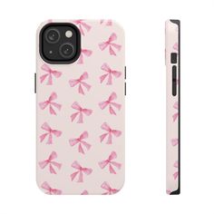 the pink bow phone case is next to an iphone 11 pro and it's holder