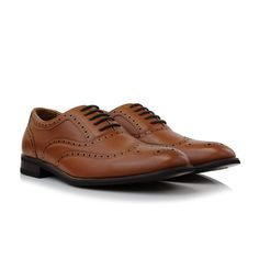 For the final touch to a stand out look, this dress shoe is the one you've been waiting for. Featuring intricate perforations and a classic wingtip design, this brogue will be an instant staple for going out. Collection: Ferro Aldo Classic brogue wingtip with contrast texture upper Perforation and stitching details Lace-up closure for an adjustable fit Stacked heel Upper: faux leather Lining: faux leather and fabric Wingtip Oxfords With Removable Insole For Semi-formal Events, Semi-formal Wingtip Oxfords With Removable Insole, Spring Wingtip Leather Shoes For Formal Occasions, Spring Formal Wingtip Leather Shoes, Formal Spring Wingtip Dress Shoes, Spring Formal Wingtip Dress Shoes, Spring Formal Dress Shoes With Wingtip Design, Elegant Formal Lace-up Shoes With Perforations, Leather Wingtip Dress Shoes With Perforations