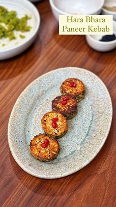 some food is on a white plate on a wooden table