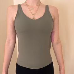 Brand New With Tags! Poshdivah Tank Top Is Crafted From A Buttery Soft Blend Of 80% Nylon And 20% Spandex, Ensuring Breathability, Elasticity, And Moisture-Wicking Properties. Built In Shelf Bra. Yoga Tops With Built-in Bra And Second-skin Fit, Green Compressive Sleeveless Top, Compressive Green Sleeveless Top, Compressive Sleeveless Green Tops, Green Stretch Tank Top, Green Stretch Tank Top For Pilates, Fitted Elastane Tank Top For Pilates, Green Seamless Tank Top For Pilates, Elastane Tops For Pilates