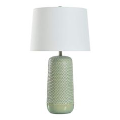 a green table lamp with a white shade on the base and a light bulb in the middle