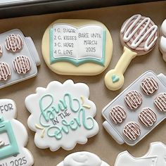 decorated cookies in the shape of baby's first names and birth dates are on display