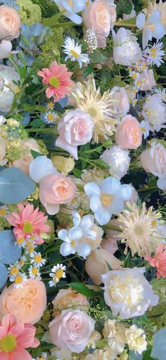 a bunch of flowers that are sitting on a table