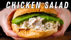 a chicken salad sandwich in someones hands