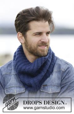 a man with a beard wearing a blue scarf