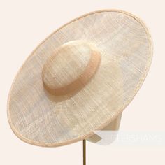 *This is not a fitted hat! You will need to sew in a headband or comb to attach it to your head* This light beige cartwheel hat base is a classic shape that has sprung into popularity in the past year. Made from 2 layers of stiffened sinamay, these cartwheels are ready to trim and are fitted with a petersham ribbon on the inside crown edge. Simply add a comb or headband to secure to the head. Hat base measures: Width: 35.5cm (14 inches) Crown Width: 13.5cm (5.3 inches) Crown Height: Approximatel Fitted Cream Hat Bands, Cream Fitted Sun Hat With Flat Brim, Fitted Brimmed Cream Hat, Natural Fitted Hat With Curved Brim, Fitted Cream Brimmed Hat, Adjustable Hat With Round Crown For Summer, Cream Straw Hat With Curved Brim, Fitted Hat With Round Crown For Kentucky Derby, Classic Adjustable Wide Brim Fascinator