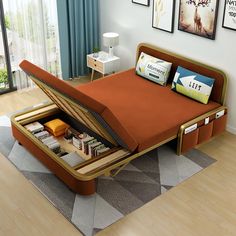 a bed with an open storage compartment in the middle of it and pictures on the wall