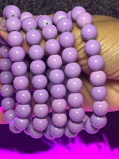 Royal Arm Candy Individual Bracelets feature 8mm or 10mm beads, making it the ideal accessory to adorn your arm and amplify its allure. What do you get: 1 bracelet Fits a 7" wrist but can stretch bigger 10mm beads Purple Stretch Bracelet With Spacer Beads, Purple Stretch Bracelet With Spacer And Round Beads, Purple Stretch Bracelet With Large Round Beads, Adjustable Stretch Bracelet With Round Beads, Hypoallergenic Rosary Bracelet With Round Beads, Purple Beaded Bracelets With Large Beads, Purple Beaded Bracelet With Large Round Beads, Purple Bracelets With Large Beads, Adjustable Stretch Bracelet With 8mm Beads