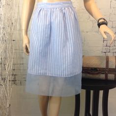 Esley Pale Blue Tulle Double Layer Midi Skirt. Checkered Top Layer, Satiny Under Layer. Hidden Back Zipper. Gorgeous And New With Tags! Size Medium Measurements- 31" Waist, 40" Hips, 24" Length 100% Polyester Thanks For Stopping By! Be Sure To Check Out Our Other Specially Curated, Fabulous Fashions! And..Feel Free To Make A Reasonable Offer! Light Blue Stretch Skirt For Summer, Light Blue Stretch Skirt For Spring, Spring Knee-length Tulle Skirt Bottoms, Knee-length Tulle Skirt Bottoms For Spring, Light Blue Lined Skirt For Summer, Blue Knee-length Summer Skirt, Light Blue Midi Skirt For Summer, Blue Midi Skirt For Spring, Chic Blue Daywear Skirt