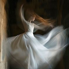 a woman in a white dress is dancing