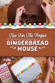 two hands are decorating a gingerbread house