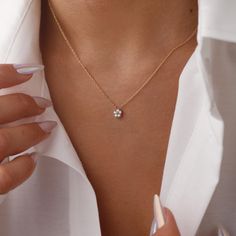 The Dainty Diamond Flower Necklace is a delicate and elegant piece, perfect for any occasion. Crafted with 925 sterling silver, it features a sparkling flower-shaped pendant adorned with cubic zirconia stones that catch the light beautifully. The minimalist design makes it versatile for everyday wear or special events. Its adjustable chain ensures a comfortable fit, making it a thoughtful gift for birthdays, anniversaries, or just because. Add a touch of sparkle to your style with this charming necklace DETAILS: ❥Material: 925k sterling silver ❥Color: Silver, Gold, Rose Gold ❥Finish: Polished ♡ You can choose from several lengths of necklaces: 14", 16", 18", 20", 22" - during your order you can select your preferred necklace length from the dropdown menu. ♡ GIFT BOX * Each order will come Dainty Everyday Necklace, Minimalist White Gold Necklace With Flower Charm, Delicate White Gold Flower Pendant Necklace, Delicate Diamond Flower Jewelry, Delicate Flower Shaped Diamond Jewelry, Delicate Diamond White Flower Jewelry, Delicate Flower-shaped Diamond Jewelry, Delicate Diamond Flower Necklace, Delicate Diamond White Flower-shaped Jewelry