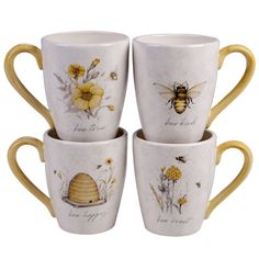 four coffee cups with bees and flowers painted on them