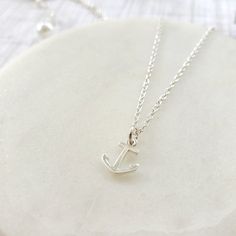 "Beautiful handmade anchor necklace in 925 sterling silver. This delicate necklace is perfect as a gift for a special woman, Christmas gift, beach wedding, bridesmaid, birthday or her special day. ♥ Details: Metal type: Sterling silver Karat / purity: 925 Anchor dimensions: 9.7 x 8.1mm Chain length: 14\", 16\", 18\", 20\". The necklace is 100% handmade. Each necklace takes approximately 2 hours to be ready, so you are buying a piece that was made with love and dedication. All jewelry comes with Minimalist Sterling Silver Jewelry For Beach, White Nautical Jewelry For Gift, Everyday Nautical Anchor Jewelry, Everyday Silver Anchor Jewelry, Nickel-free Anchor Shaped Sterling Silver Jewelry, Nickel-free Sterling Silver Anchor Jewelry, Everyday Silver Jewelry With Anchor Shape, Silver Nautical Jewelry With Adjustable Fit, Silver Anchor Jewelry Gift