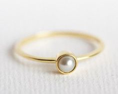 Pearl Engagement Ring Gold Pearl Ring Pear Pearl by capucinne Minimalist Formal Pearl Drop Ring, Minimalist Solitaire Pearl Ring For Formal Occasions, Classic White Pearl Ring With Simple Design, Elegant Pear-shaped Ring With Single Diamond, Dainty Rose Gold Pearl Ring For Formal Occasions, Elegant Pearl Ring With Bezel Setting For Formal Occasions, Elegant Pearl Ring With Bezel Setting For Formal Events, Elegant Formal Pearl Ring With Bezel Setting, Elegant Wedding Jewelry With Smooth Bezel