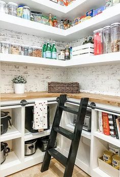 a ladder is in the middle of a pantry