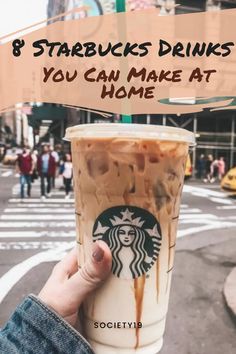 someone holding up a starbucks drink with the words 8 starbucks drinks you can make at home