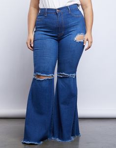 The '70s are coming back and we are fully here for it. Channel your inner groovy baby in the Curve Far Out Jeans. These jeans feature a stretchy blue denim material, a high rise waist, frayed flare bottoms, two ripped knee details and one rip detail on the side. We love to see these jeans paired with platform sandals and a rock n roll tee to complete that gorgeous groovy vibe. Model is 5'8.5", bust 40" D, waist 32.5", hips 45.5", and is wearing a size 1XL. Materials and Care These jeans are made 70s Summer Fashion Plus Size, 70s Inspired Outfits Plus Size, 70s Bohemian, 70s Girl, Flare Bottoms, Super Flare Jeans, Plus Size Looks, Flair Jeans, 70s Inspired Fashion